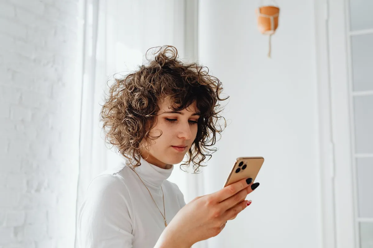 Woman reading a message on her phone